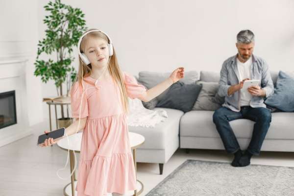 Parent and child singing syllable song together