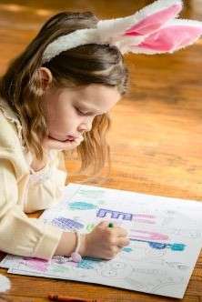 A child practicing letter formation