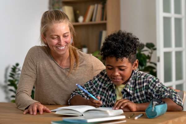 A mother enjoying a moment with her son as they learn syllables