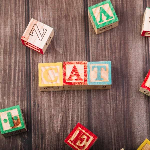 An engaging, multi-colored wooden alphabet puzzle displayed on a table, aiding in the development of your child's letter sound recognition skills.