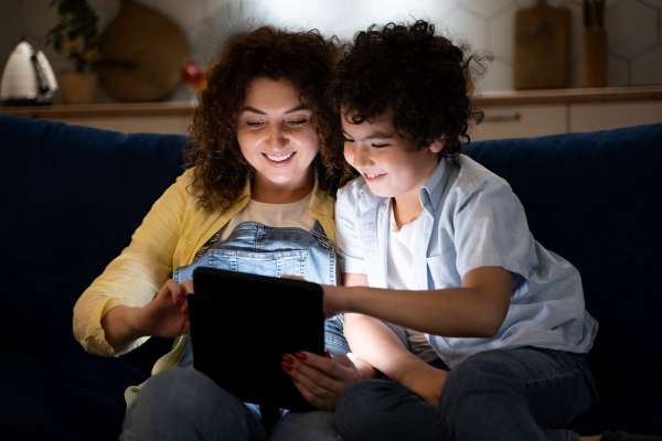 Child-engaging-with-word-families-game-on-tablet