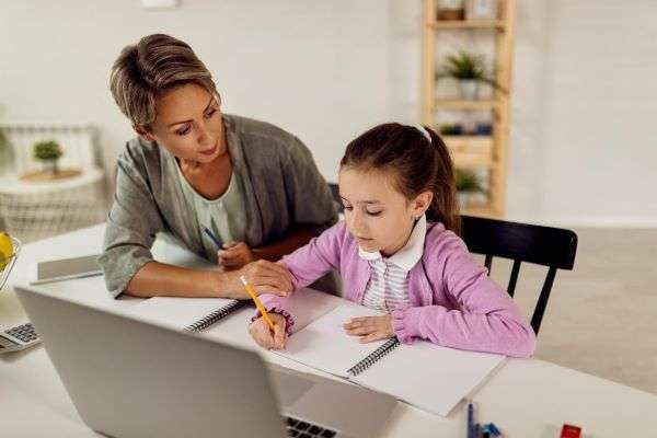 A tutor helping a child with grammar.