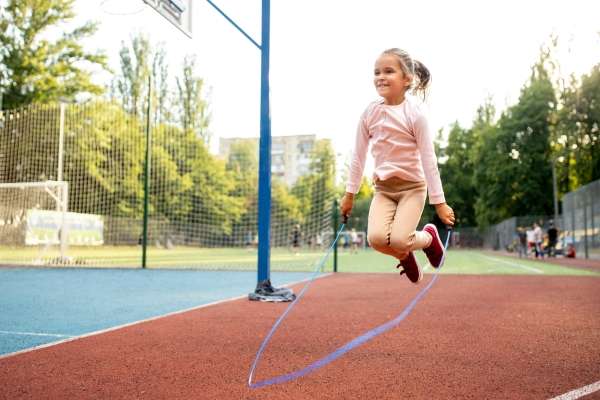 Kids counting jumps in an outdoor play area to make math fun and interactive