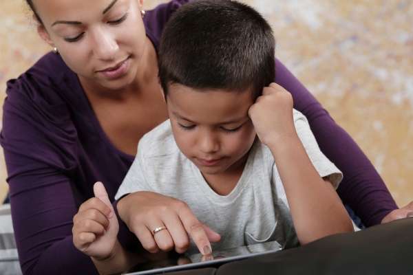 Preschooler using a counting app.