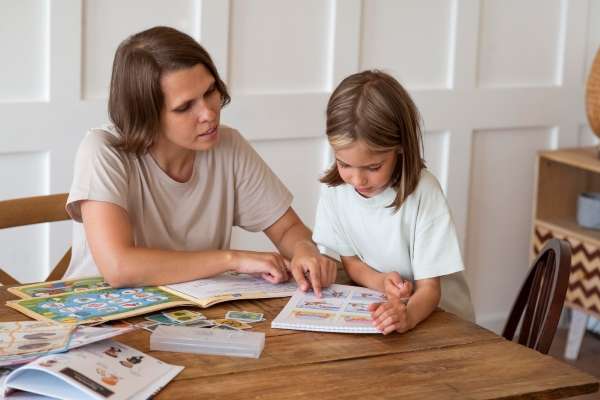 A parent introducing numeracy to her child through books.