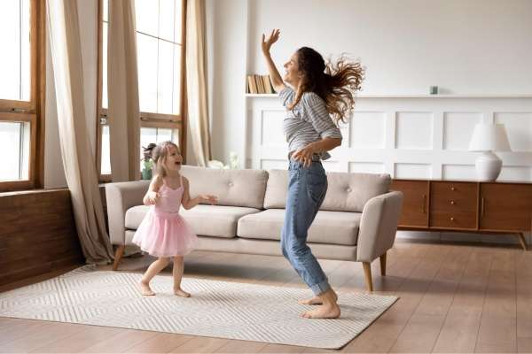 Mother and child dancing happily and they learn sorting and classifying concept trough music