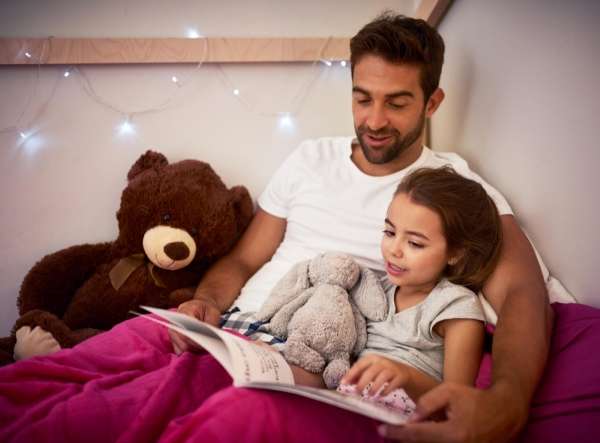 Parent an child enjoying a story time.