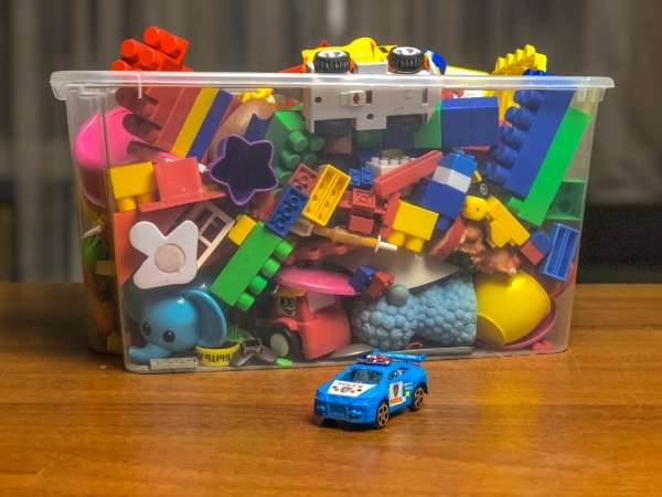 An assortment of toys in a box to helping a child in learning basic graphing concepts