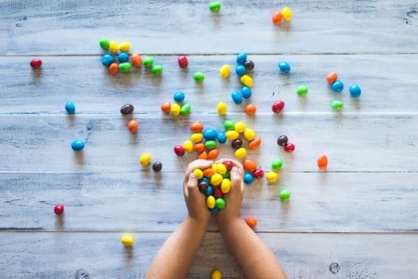 Mixed colorful toys candies for sorting.