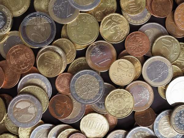 Close-up view of labeled coins showcasing their values.