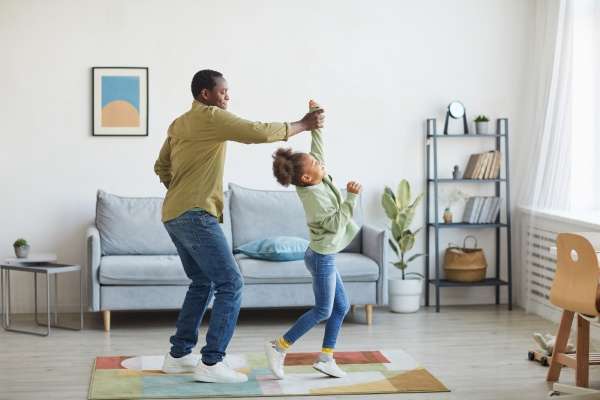 Father and daughter incorporating movement as they learn data collection and analysis concept