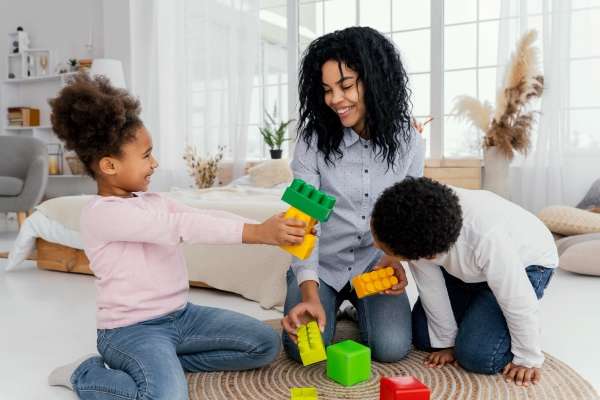 Mother playing with children. Using toys for a comparison game