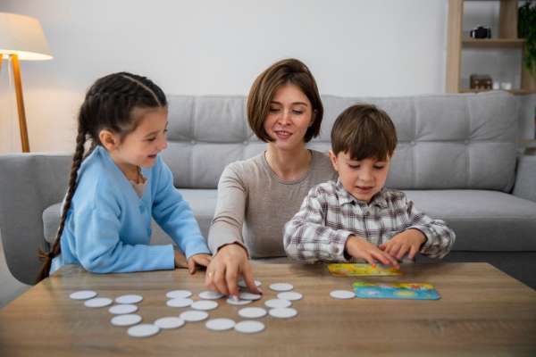 parent and kids playing "Number War" card game.