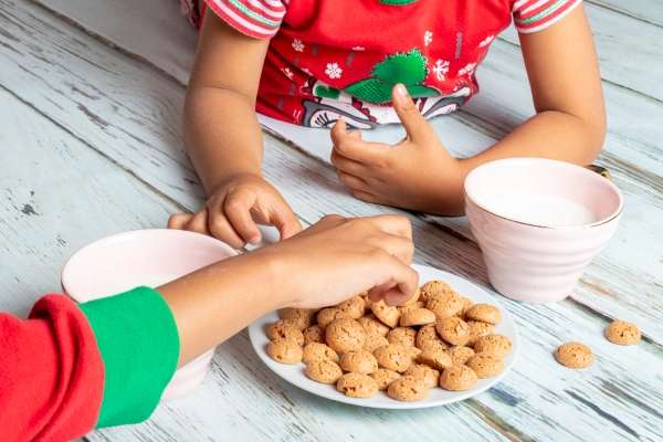 Child counting cookies for a fun math activity to learn basic statistics concepts.