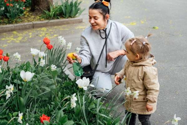 grandmother and toddler using flowers to learn about graphic concepts