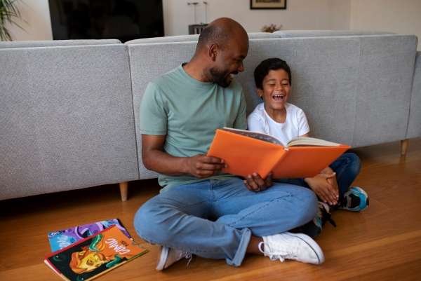 Parent enjoying learning and story telling with his child.