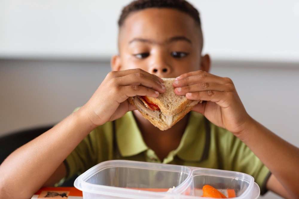 A child enjoying a sandwich. 
A great way to understand basic geometry concepts.