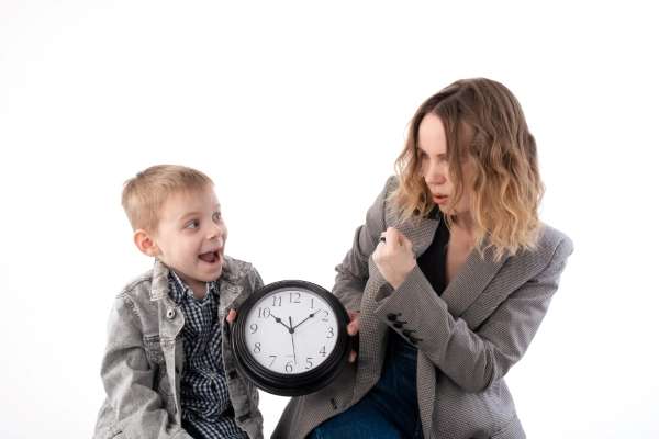 A mother and child learning an analog clock. A great too to teach basic time management.