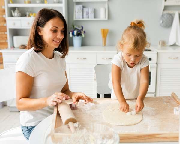 Mother and child learning how to make salt dough ornaments